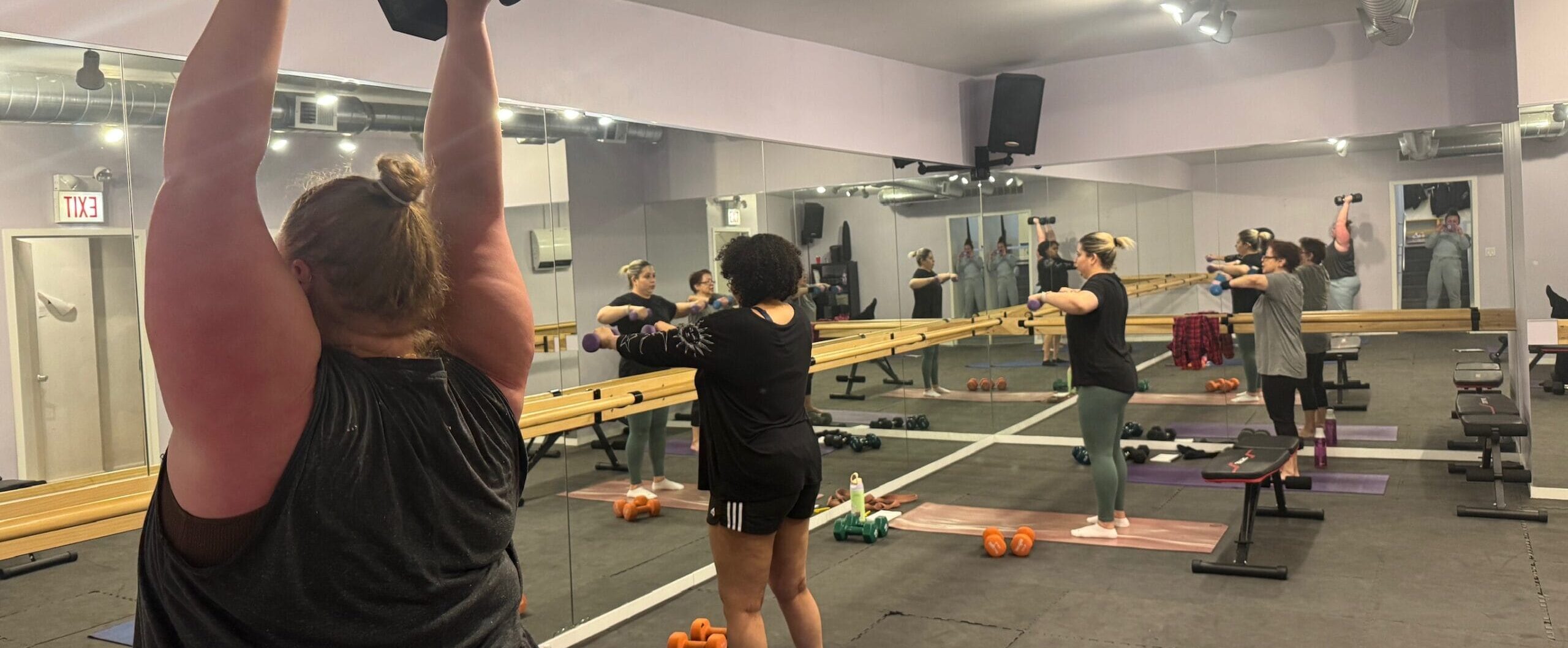 November Member Of The Month - Morgan Gallogly A Group Of Women Lifting Weights In A Gym